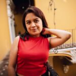 Charming portrait of a woman in a red top in Puebla, Mexico